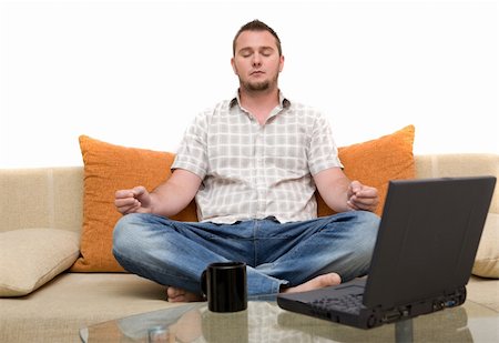 simsearch:400-04540351,k - happy man sitting on sofa with laptop Stock Photo - Budget Royalty-Free & Subscription, Code: 400-04027623