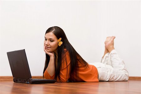 student working home office - casual woman lying on flor with laptop Stock Photo - Budget Royalty-Free & Subscription, Code: 400-04027632