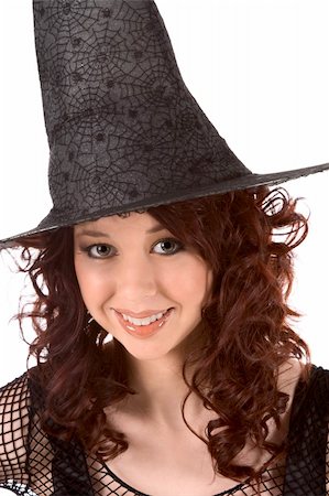 simsearch:400-04007612,k - Portrait of Latina teenager girl in black Halloween hat and fishnet dress Stock Photo - Budget Royalty-Free & Subscription, Code: 400-04028019