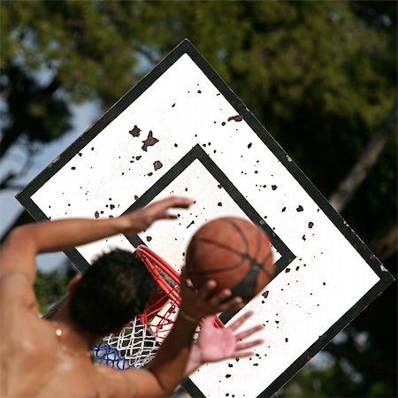 shooting the head with the hand - Basketball player shooting over his opponent Stock Photo - Budget Royalty-Free & Subscription, Code: 400-04028055