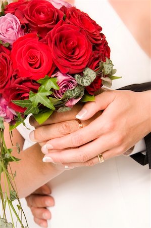 simsearch:400-03932395,k - The bride and bridegroom holding a wedding bouquet Fotografie stock - Microstock e Abbonamento, Codice: 400-04028140