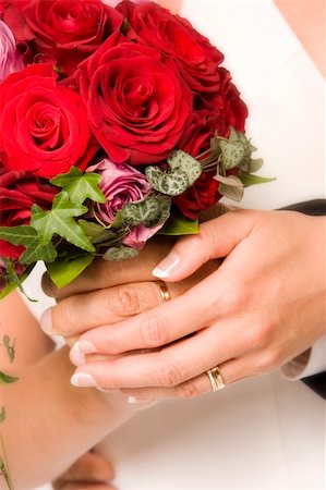 simsearch:400-07332647,k - The bride and bridegroom holding a wedding bouquet Stockbilder - Microstock & Abonnement, Bildnummer: 400-04028141