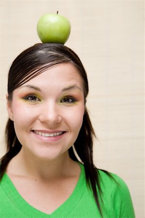 simsearch:400-04564926,k - attractive brunette woman holding apple Photographie de stock - Aubaine LD & Abonnement, Code: 400-04028668