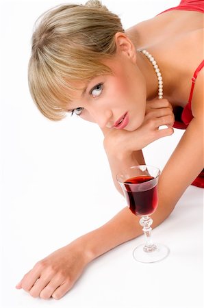 simsearch:400-04629496,k - blond girl with necklace laying down on the floor near a glass of red wine Photographie de stock - Aubaine LD & Abonnement, Code: 400-04028684