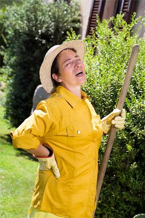 Tired senior Italian woman having backache while gardening Stockbilder - Microstock & Abonnement, Bildnummer: 400-04029833