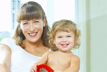 simsearch:400-04535025,k - High key portrait of happy mother with baby Stock Photo - Budget Royalty-Free & Subscription, Code: 400-04029851