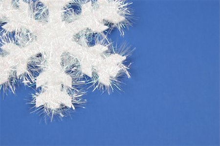 round ornament hanging of a tree - White snowflake on blue background Stock Photo - Budget Royalty-Free & Subscription, Code: 400-04020155