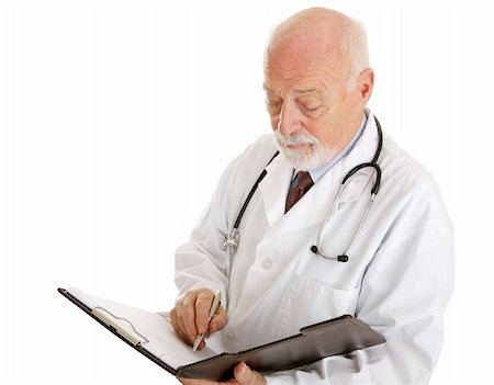 simsearch:400-04217553,k - Handsome mature doctor making notations in a patients chart.  Isolated on white. Foto de stock - Royalty-Free Super Valor e Assinatura, Número: 400-04020228