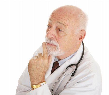 simsearch:400-05192324,k - Mature, experienced doctor lost in thought.  Isolated on white. Stock Photo - Budget Royalty-Free & Subscription, Code: 400-04020229