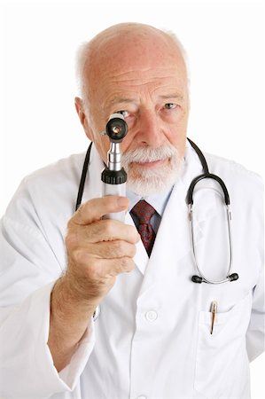 simsearch:400-04552598,k - Handsome mature doctor examines you with his otoscope.  Isolated on white. Foto de stock - Super Valor sin royalties y Suscripción, Código: 400-04020230