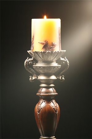 simsearch:614-01561575,k - Antique wooden candlestick with ray of light isolated on black background Stock Photo - Budget Royalty-Free & Subscription, Code: 400-04020582