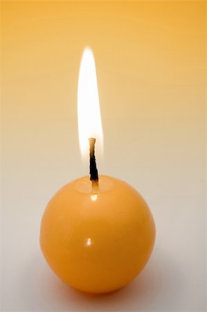 simsearch:400-04143553,k - small yellow burning candle, yellow to grey background Stock Photo - Budget Royalty-Free & Subscription, Code: 400-04021065