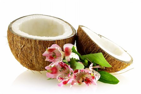 two pieces of ripe coconut with flowers over white background Foto de stock - Super Valor sin royalties y Suscripción, Código: 400-04021120