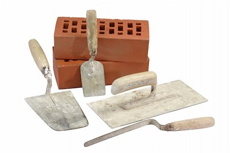 simsearch:400-04494971,k - Used trowels with red bricks - isolated on white background Stock Photo - Budget Royalty-Free & Subscription, Code: 400-04021403