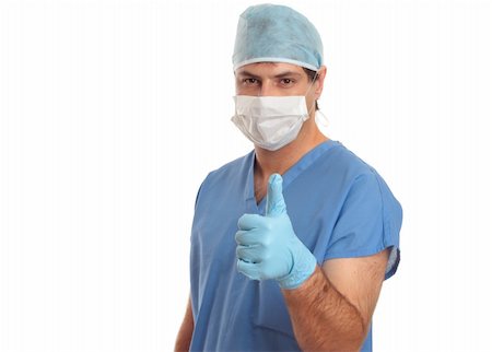 Surgeon or medical scrub nurse giving the thumbs up hand signal of quality, perfection,  approval, excellence, success, etc.  He is looking ahead standing against a plain white background with space for copy or other design elements. Stock Photo - Budget Royalty-Free & Subscription, Code: 400-04021446