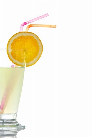 simsearch:400-03950882,k - A glass of lemon juice with a slice and straws, reflected on white background Stockbilder - Microstock & Abonnement, Bildnummer: 400-04021550