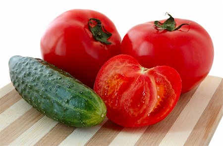 striped tomato - Vegetables (tomatos and cucumber) on bamboo cutting board. Stock Photo - Budget Royalty-Free & Subscription, Code: 400-04022175