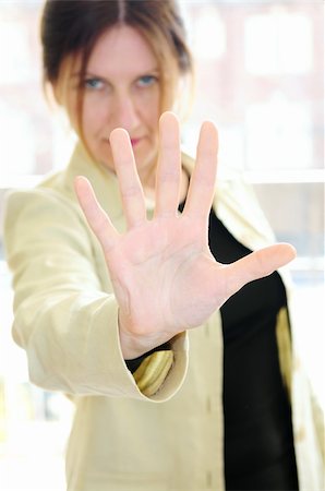 Mature woman gesturing stop with palm of her hand Foto de stock - Super Valor sin royalties y Suscripción, Código: 400-04022378