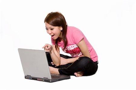 eyedear (artist) - young teen chatting happily online pointing to the laptop Stock Photo - Budget Royalty-Free & Subscription, Code: 400-04022450