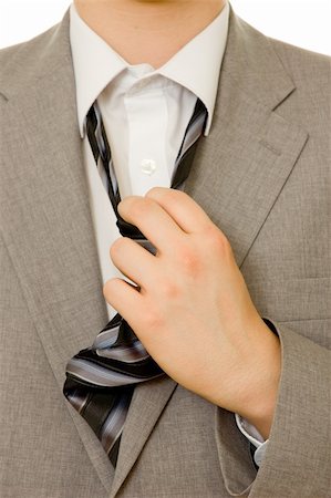Stressful businessman untying his necktie Stock Photo - Budget Royalty-Free & Subscription, Code: 400-04023404