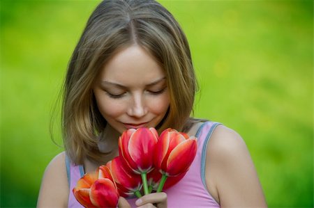 peeping fashion - beautiful young lady with flowers outdoor smiling Stock Photo - Budget Royalty-Free & Subscription, Code: 400-04023413