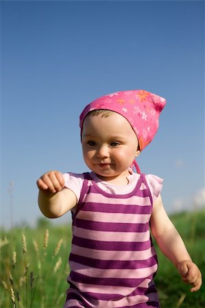 simsearch:400-04067084,k - happy baby girl on green meadow Stock Photo - Budget Royalty-Free & Subscription, Code: 400-04023479