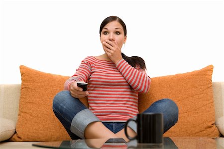 simsearch:400-04540885,k - attractive brunette woman on sofa with remote control Foto de stock - Royalty-Free Super Valor e Assinatura, Número: 400-04023484