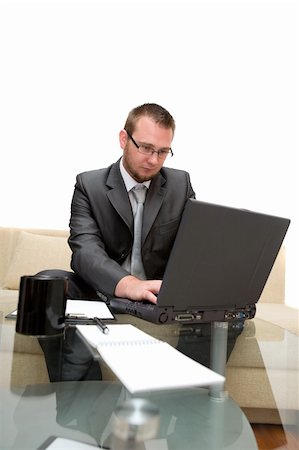 simsearch:400-04540351,k - happy man sitting on sofa with laptop Stock Photo - Budget Royalty-Free & Subscription, Code: 400-04023492