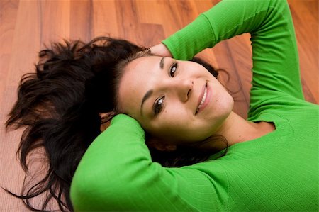 brunette woman lying on the floor Stock Photo - Budget Royalty-Free & Subscription, Code: 400-04023510