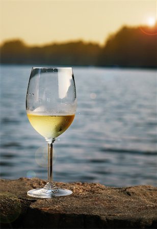 A glass of chardonnay on a lake in Connecticut Stock Photo - Budget Royalty-Free & Subscription, Code: 400-04023621