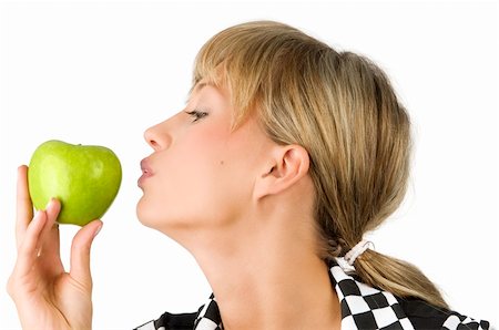 portrait photo teenage girl long blonde hair'''' - pretty blond girl kissing the green apple in her hand Stock Photo - Budget Royalty-Free & Subscription, Code: 400-04023795