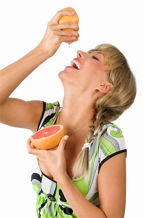 fresh portrait of a girl laughing and drinking juice from squeezed grapefruit Stock Photo - Budget Royalty-Free & Subscription, Code: 400-04023815