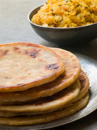 paratha - Plate of Aloo stuffed Parathas Stock Photo - Budget Royalty-Free & Subscription, Code: 400-04034063