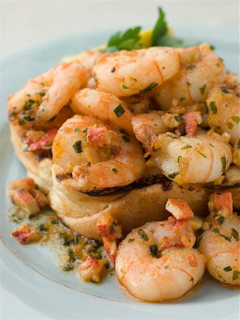 Toasted Brioche topped with Prawns cooked In Lobster Garlic Butt Stock Photo - Budget Royalty-Free & Subscription, Code: 400-04034181
