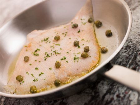 skate fish recipes - Pan Fried Wing of Skate with Caper Butter Stock Photo - Budget Royalty-Free & Subscription, Code: 400-04034191