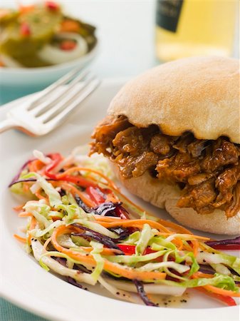 simsearch:400-04034225,k - Pulled Pork and Barbeque Sauce Roll with Seeded Slaw and Gherkin Stockbilder - Microstock & Abonnement, Bildnummer: 400-04034208