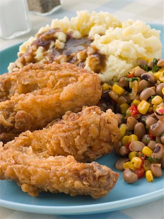 Southern Fried Chicken Wings with Mash Potato Beans and Gravy Stock Photo - Budget Royalty-Free & Subscription, Code: 400-04034217