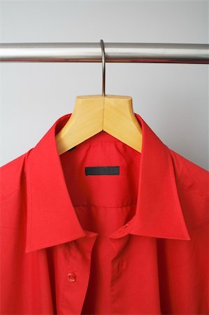 dresses closet - A Red men's dress shirt hanging on a hanger Photographie de stock - Aubaine LD & Abonnement, Code: 400-04034893