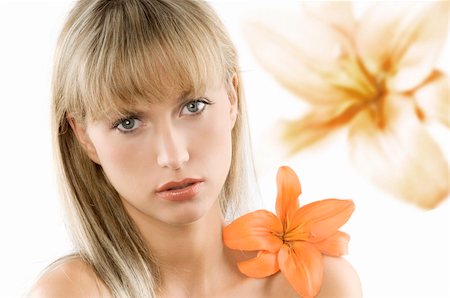 simsearch:400-06096871,k - blond and young beautiful woman with an orange flower on her shoulder Stock Photo - Budget Royalty-Free & Subscription, Code: 400-04034908