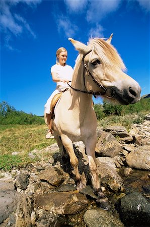 simsearch:400-04034948,k - Young woman crossing a river by horse Stock Photo - Budget Royalty-Free & Subscription, Code: 400-04034947