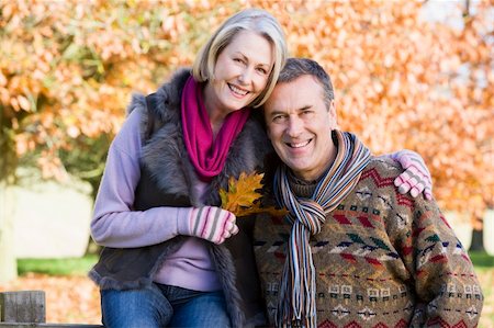 simsearch:400-05735475,k - Affectionate senior couple on autumn walk with trees in background Stock Photo - Budget Royalty-Free & Subscription, Code: 400-04035049