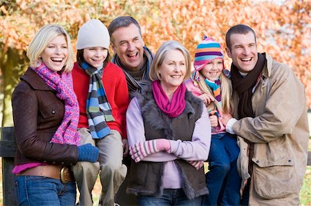 Multi-generation family on autumn walk sitting on fence Stock Photo - Budget Royalty-Free & Subscription, Code: 400-04035057