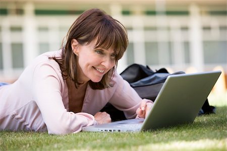 student college laptop lying grass - Woman using laptop on campus Stock Photo - Budget Royalty-Free & Subscription, Code: 400-04035236