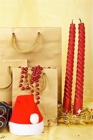 simsearch:400-04484693,k - Christmas decoration with balls, hat, bags and candles, over yellow background Foto de stock - Super Valor sin royalties y Suscripción, Código: 400-04035498