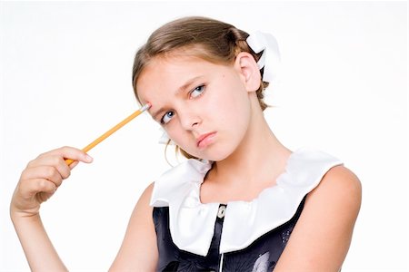 Puzzled pretty schoolgirl making a hard decision Stock Photo - Budget Royalty-Free & Subscription, Code: 400-04035639