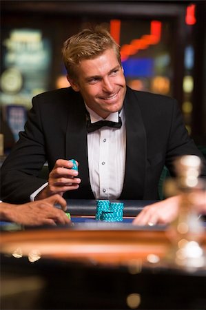 Man gambling at roulette table in casino looking confident Stock Photo - Budget Royalty-Free & Subscription, Code: 400-04035670