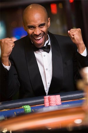 Man winning at roulette table in casino Stock Photo - Budget Royalty-Free & Subscription, Code: 400-04035683