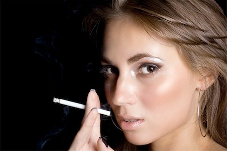simsearch:400-04631926,k - portrait of the beautiful young woman with a cigarette 1 Stock Photo - Budget Royalty-Free & Subscription, Code: 400-04035708