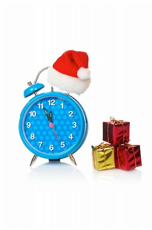 simsearch:700-05974049,k - Blue alarm clock with christmas hat and gifts, reflected on white background Stock Photo - Budget Royalty-Free & Subscription, Code: 400-04035700