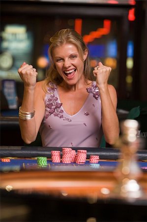 Woman winning at roulette table in casino Stock Photo - Budget Royalty-Free & Subscription, Code: 400-04035714